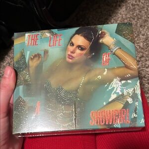 Taylor Swift “The Life of a Showgirl” guessing keychain and photos